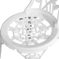 White aluminium outdoor chair on grass beside white round table from the bistro set.