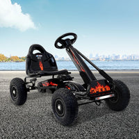 Black pedal go kart angled front view showing sleek frame and durable rubber tires
