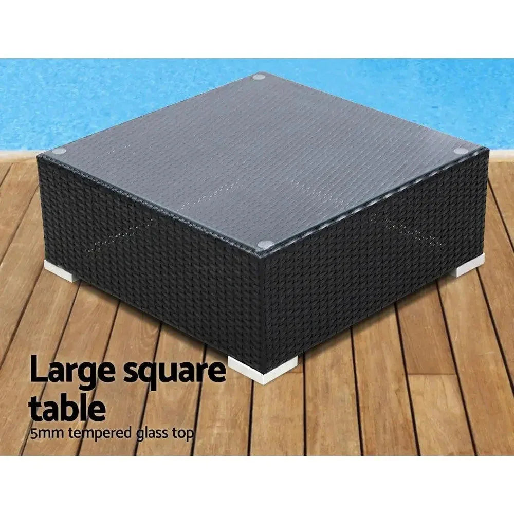 Gardeon outdoor sofa set with central glass-top table and two corner side tables on outdoor flooring.