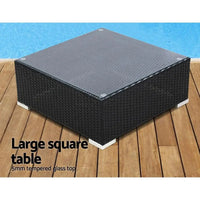 Removable light beige cushions on dark brown wicker outdoor sectional sofa set.