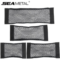 Black car trunk storage bag with multiple compartments and elastic strings holding items securely.