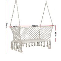 Cream-colored two-person hammock chair viewed on a white background.