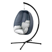 Foldable grey hanging egg chair with cushion shown from front angle.