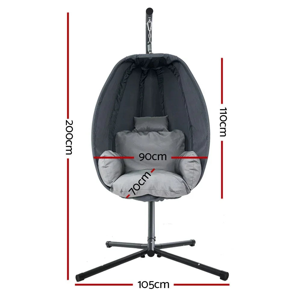 Side view of grey hanging egg chair with soft cushion and steel frame.