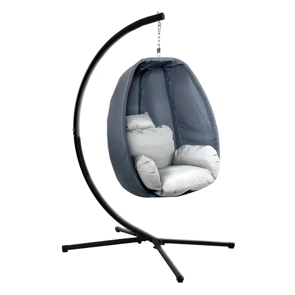 Foldable outdoor hanging chair attached to sturdy steel stand.