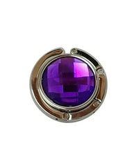 Purple handbag hanger with foldable arm and rhinestone top viewed from above.