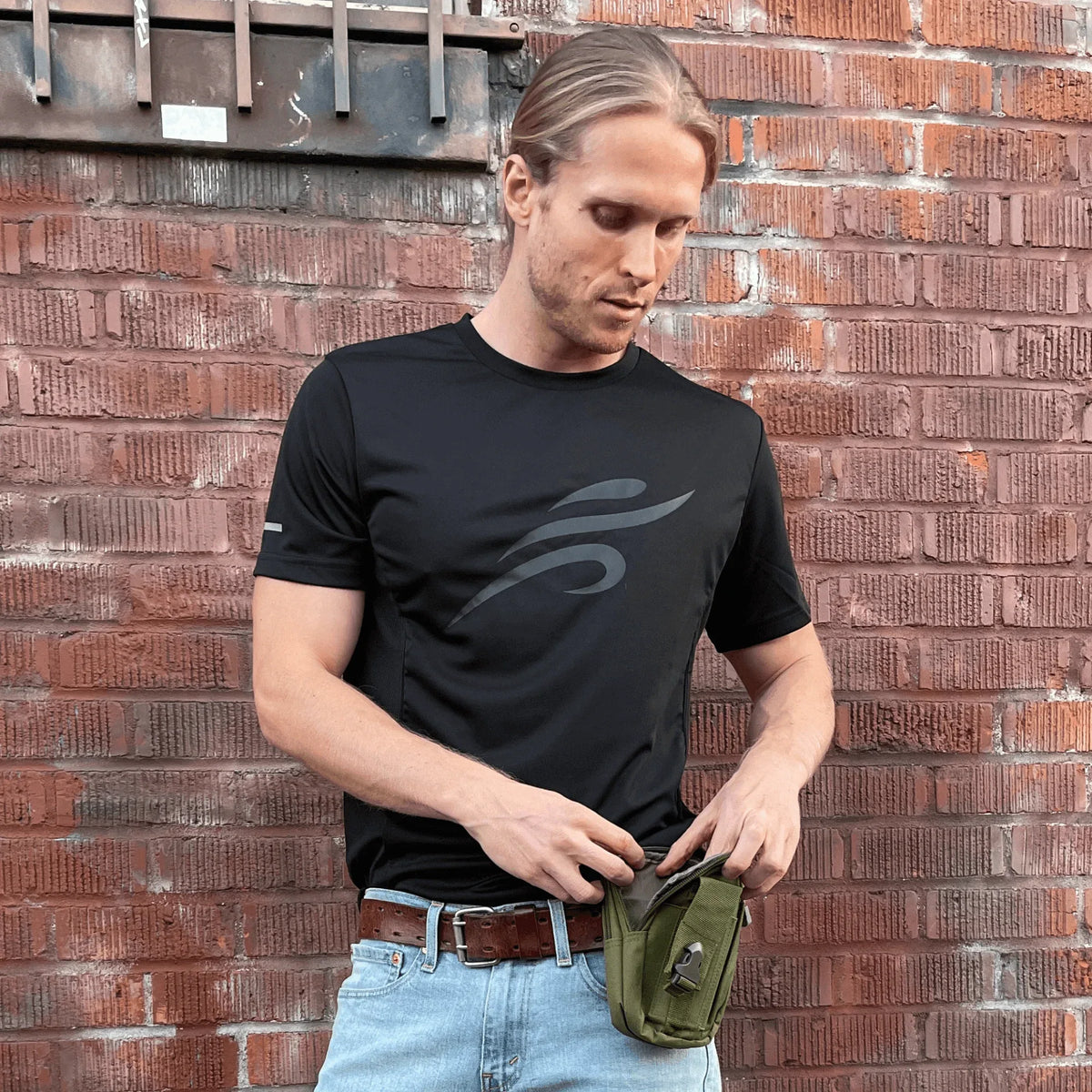 Side view of army green MOLLE pouch showing adjustable straps and rugged construction.