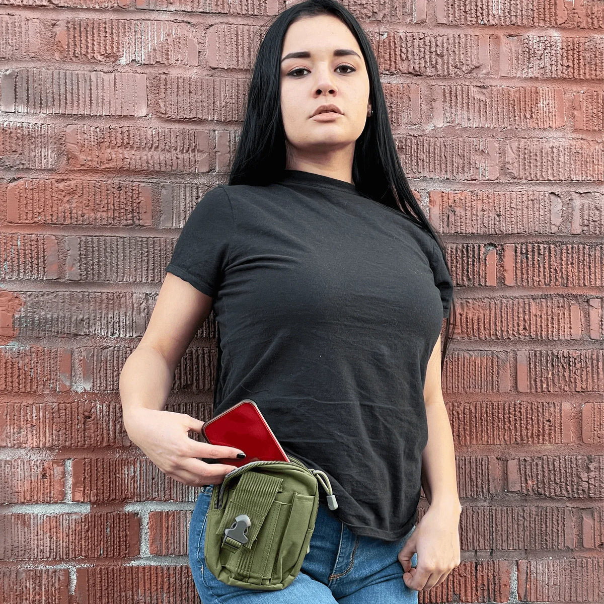 Close-up of army green tactical MOLLE waist pouch highlighting durable fabric and fastening straps.