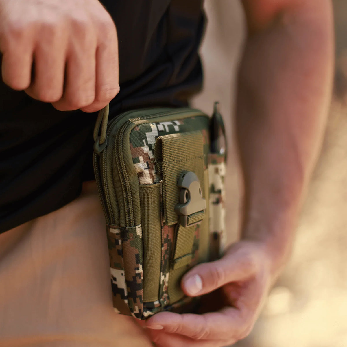 Tactical MOLLE pouch open with contents showing organized interior compartments.