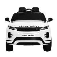 Front angle of white kids 12V Land Rover ride on car highlighting headlights and grill.