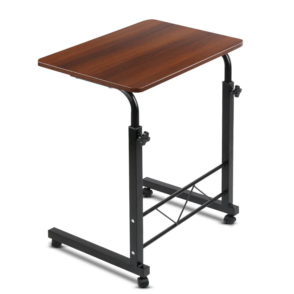 Dark wood portable laptop table desk with adjustable height and U-shape frame over sofa seat.