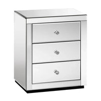 Artiss mirrored bedside table with three drawers and crystal glass handles in bright room.