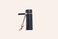 Open pebble leather lipstick holder showing interior stitching and pocket