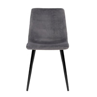 Side view of grey modern dining chair showing velvet seat and sturdy iron frame and legs.