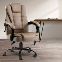 Black massage office chair reclining fully with footrest extended for comfort.