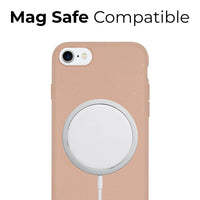 Phone case with pastel pink color supporting MagSafe charging on an iPhone.