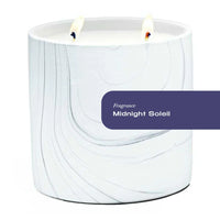 White marble ceramic candle holder with gray and black swirls, filled with a large white candle.