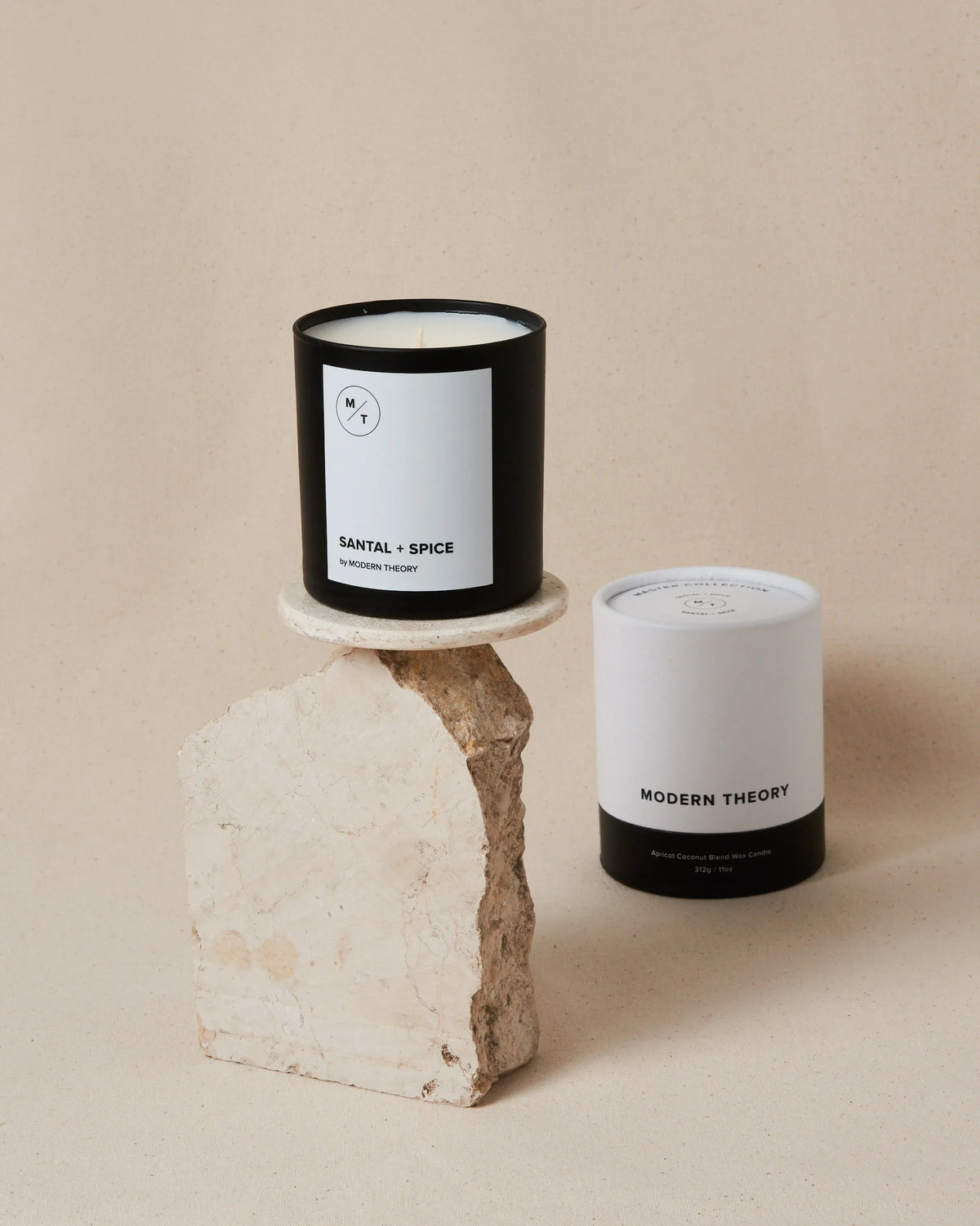 Close-up of the SANTAL + SPICE candle’s label highlighting its natural ingredients and clean design.