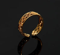 Hélodie Ring shown at angle emphasizing its delicate and adjustable gold band