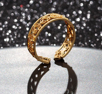 Hélodie Ring in soft gold finish with elegant smooth band, styled simply