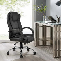 Assembled black PU leather office chair with ergonomic design on hardwood floor in office.