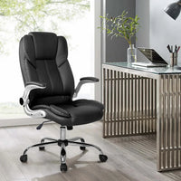 Black leather office chair angled to show both back support and retractable armrest