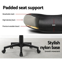Tilted view of mid-back mesh office chair highlighting adjustable lumbar support and cushion.