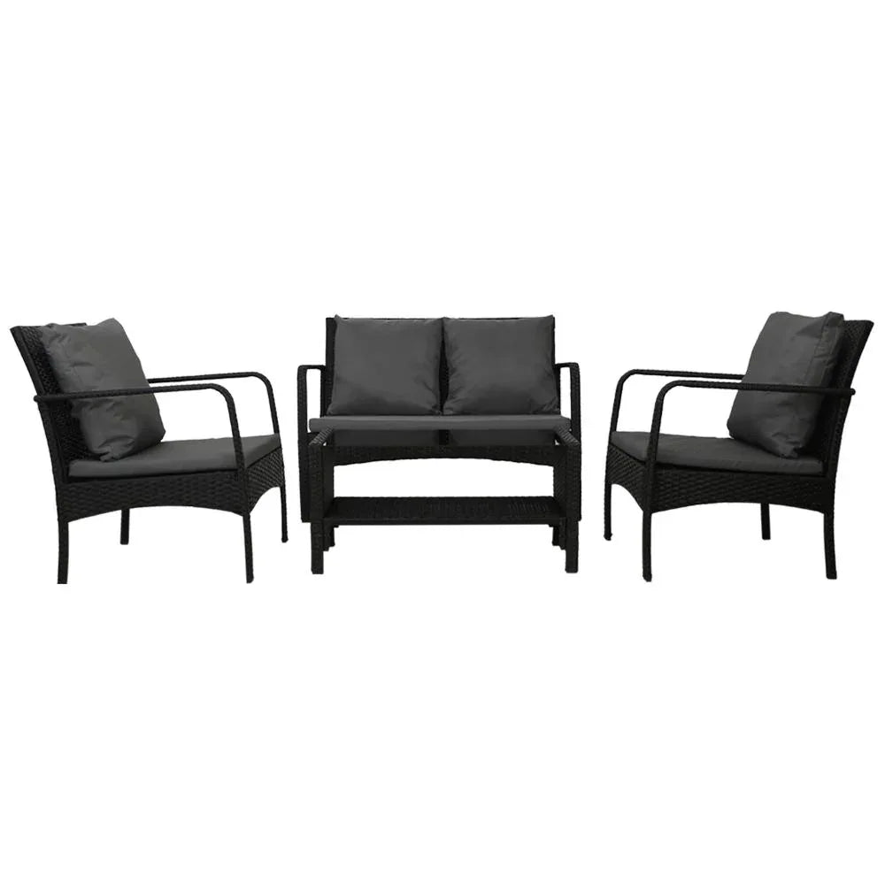 Two armchairs and two-seater loveseat in black rattan wicker with beige cushions arranged outdoors.