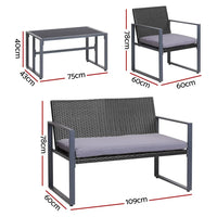 Close-up of black outdoor chair with thick cushion and woven PE wicker frame.