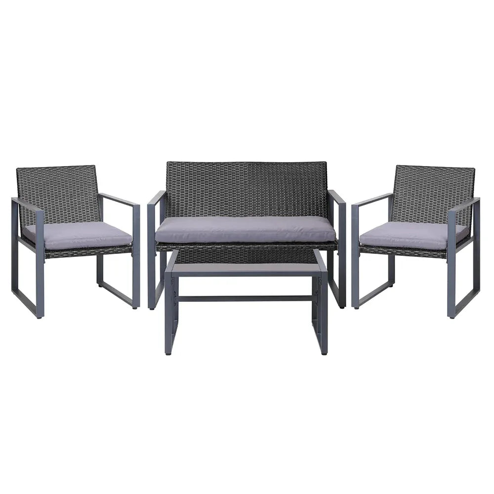 Black outdoor table with tempered glass top and modern square design in patio setting.