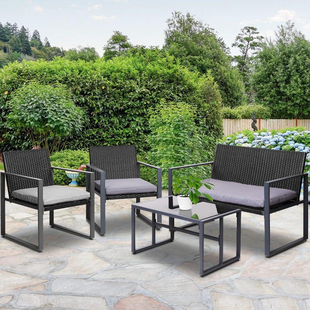 Overhead perspective of stylish black four-piece outdoor patio table and chairs set.