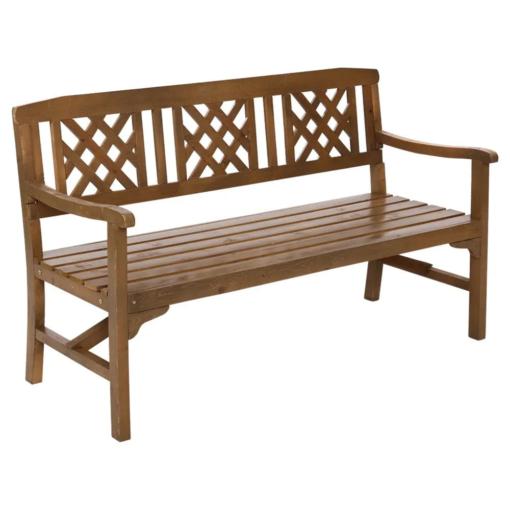 Rustic three-seat wooden garden bench with lattice backrest on green grass outdoors