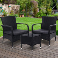 Wicker patio set including two chairs and small table under bright natural light.