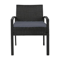 Profile view of black wicker outdoor chair showing curved armrests and cushion