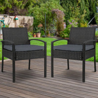 Back angle of black wicker outdoor chair showing woven design and padded cushion