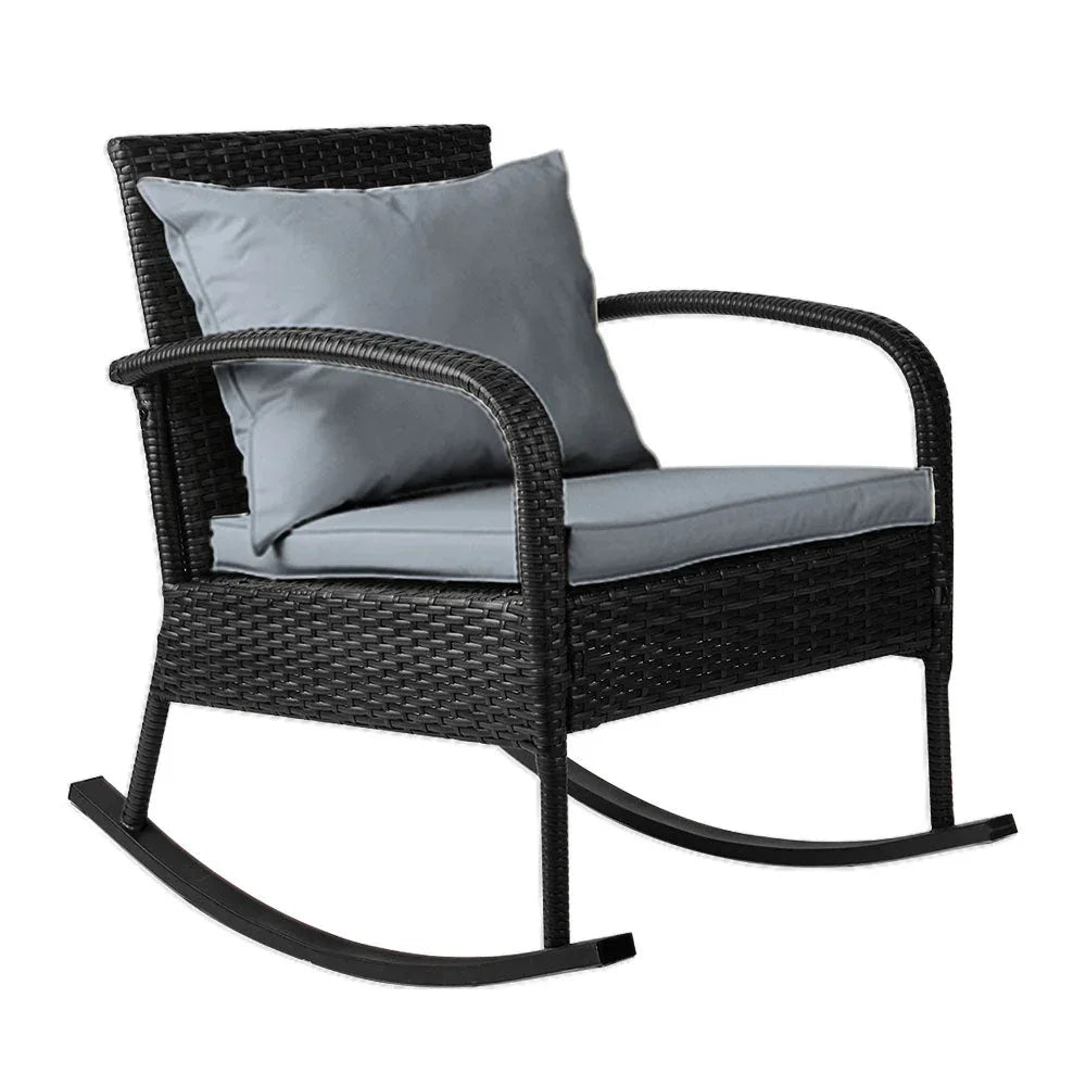 Gardeon Outdoor Rocking Chair in black resin rattan with thick cushions on a wooden deck.