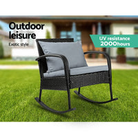 Close detail of the chair’s armrest and cushioned pillow in an outdoor garden setting.