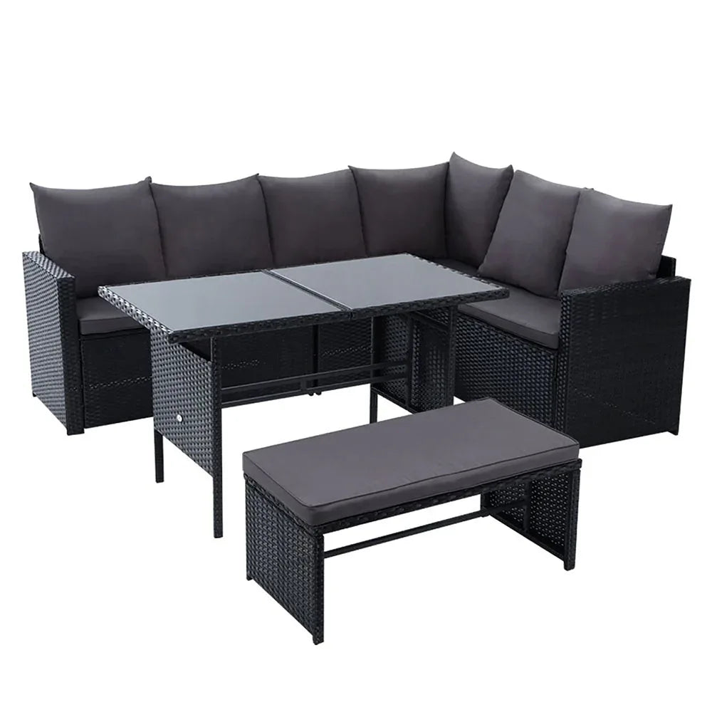 Black outdoor wicker bench seat of Gardeon dining sofa set on patio with cushions