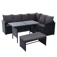 Black outdoor wicker bench seat of Gardeon dining sofa set on patio with cushions