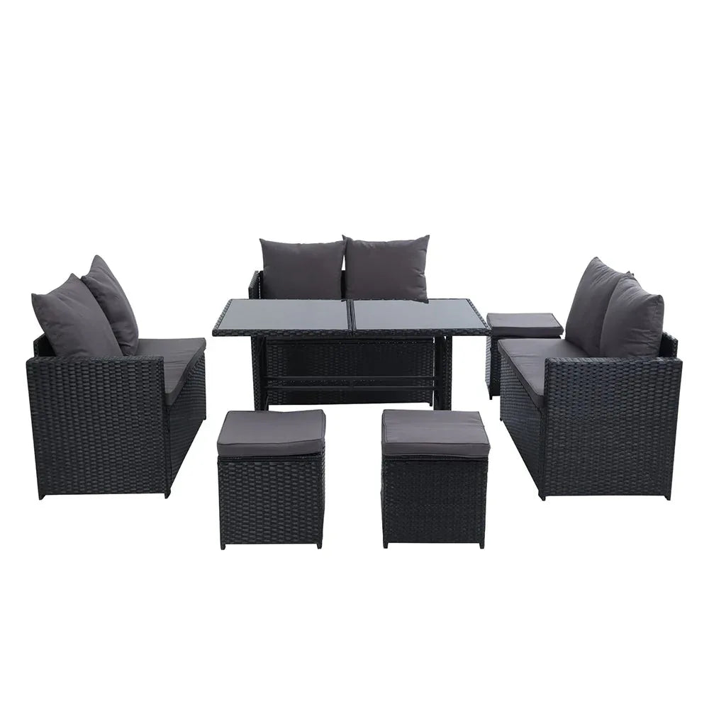 Top view showing L-shaped arrangement of black wicker sofa with beige cushions on wooden deck.