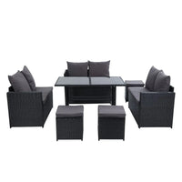 Top view showing L-shaped arrangement of black wicker sofa with beige cushions on wooden deck.