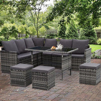 Top angle of modular wicker outdoor sofa set with clean cream-colored cushions.