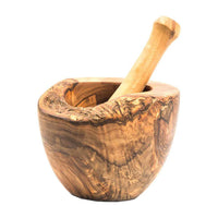 Detailed view of olive wood mortar and pestle highlighting unique wood texture.