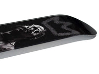 King Travis Skateboard displayed diagonally on white background.