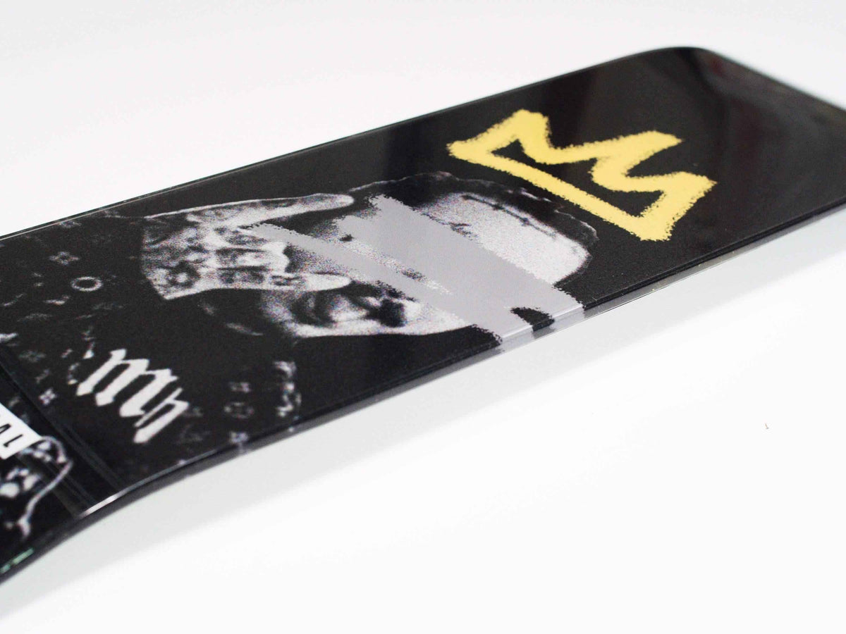 Side view of Posty Skateboard highlighting the deck shape and wheel setup.