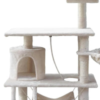 View of the cat condo with entry opening and velvety beige covering.