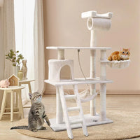Full view of tall beige cat tree with multiple levels, hiding areas, and vertical posts.