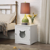 White wooden pet house side table with decorative cat hole, clean modern design in bright room.