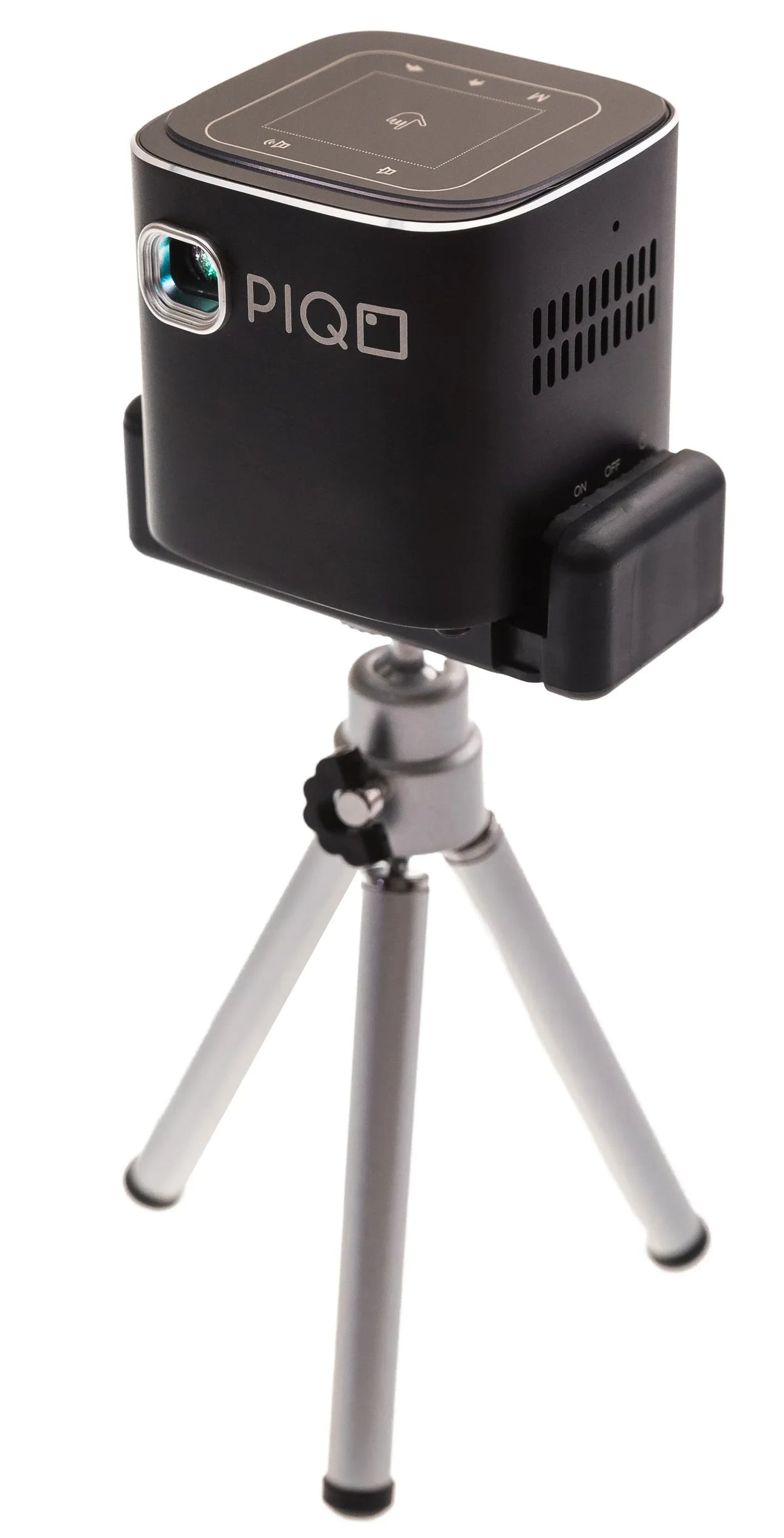 PIQO projector displaying streaming content with Android interface on a white surface.