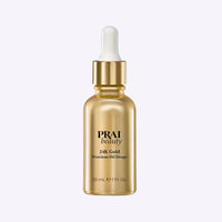 Bottle of PRAI Beauty 24K Gold Precious Oil Drops with golden oil and botanical ingredients